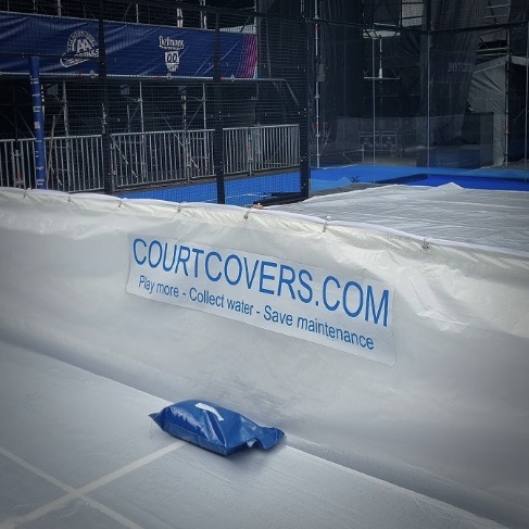 Full padel court covered by Courtcover All-Weather Padel Court Cover, with designated advertising spaces on the cover, protecting the court from all weather.